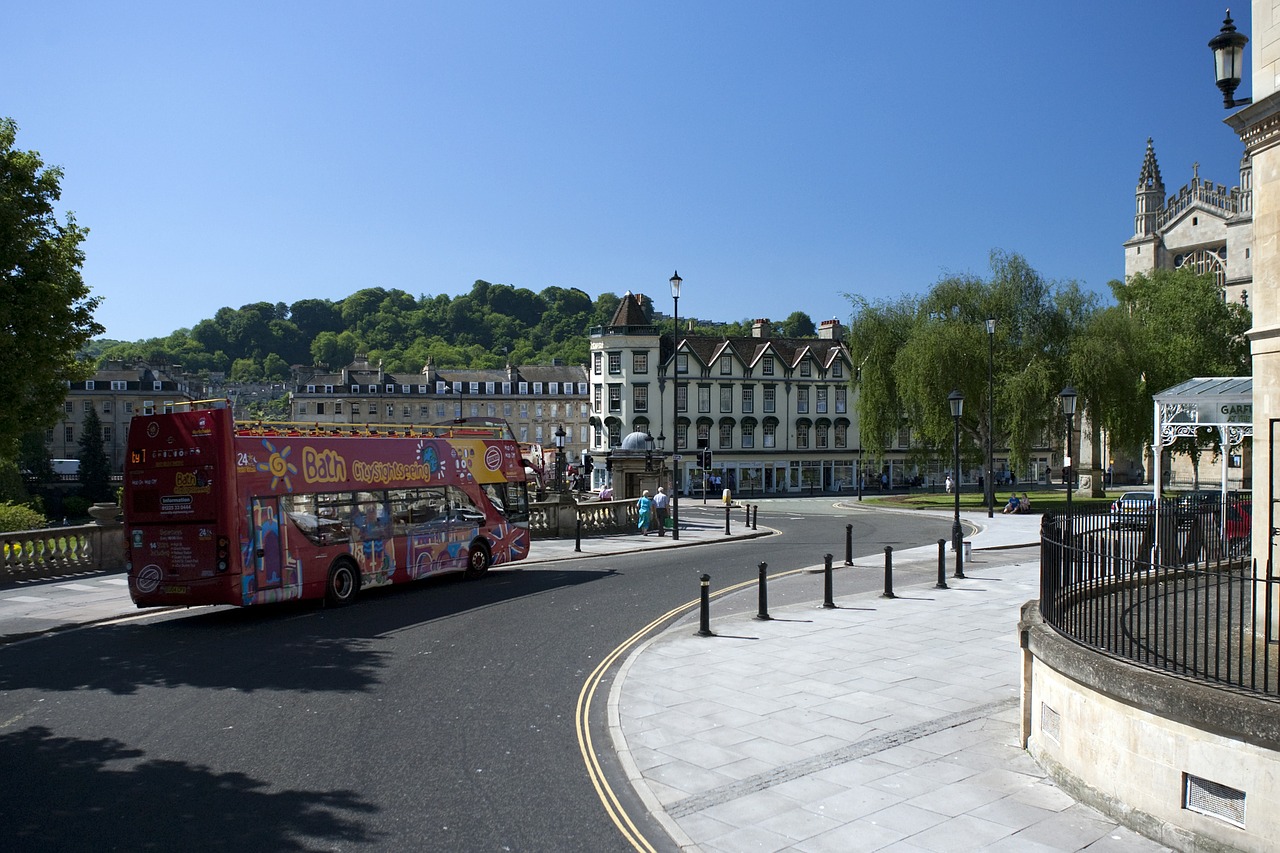 A tourist street with tour bus Photo by RonPorter on Pixabay