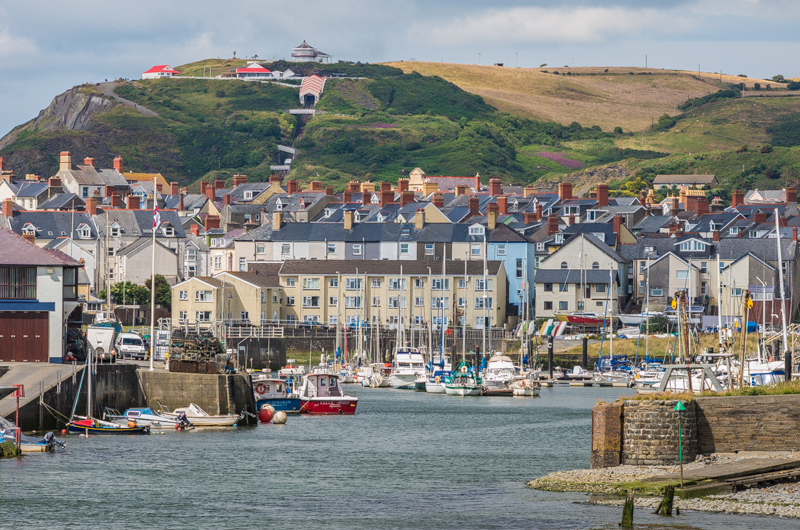 Aberystwyth Harbour with Constitution Hill behind and the town between.