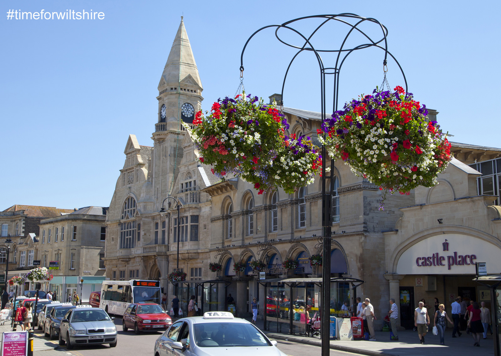 Trowbridge Town Hall shows summer flower displays and hanging baskets © Visit Wiltshire